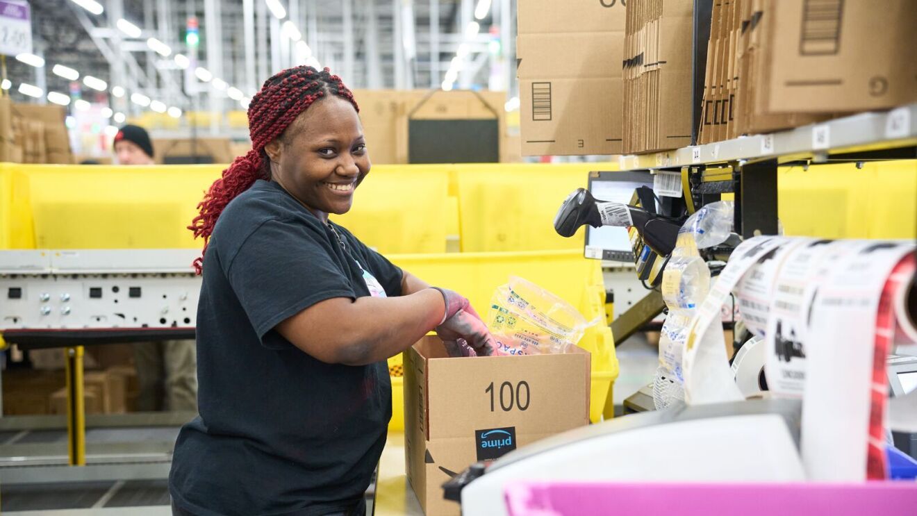 Image of an employee working in an Amazon fulfillment center.