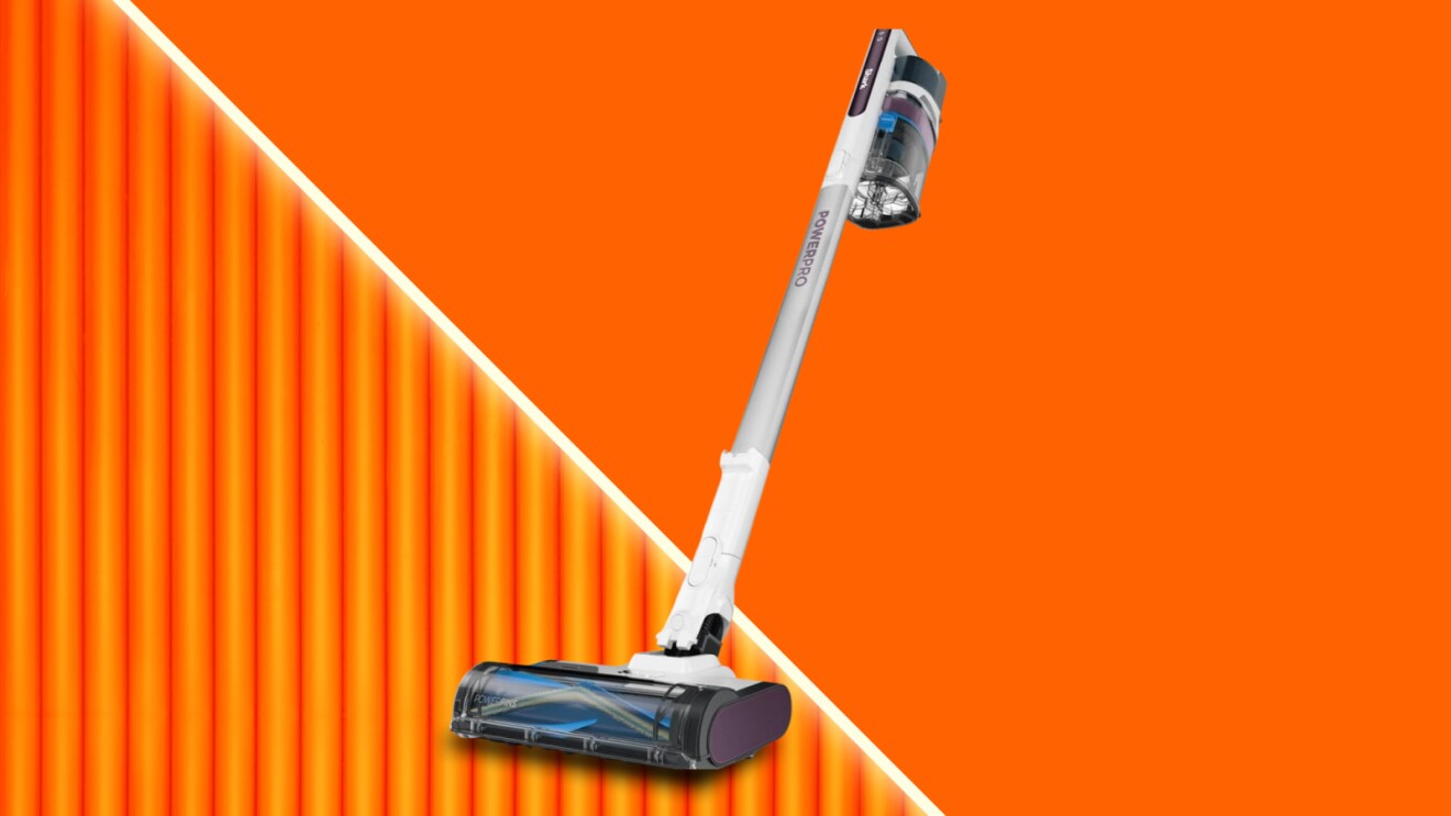 Cordless Shark stick vacuum on vibrant orange background
