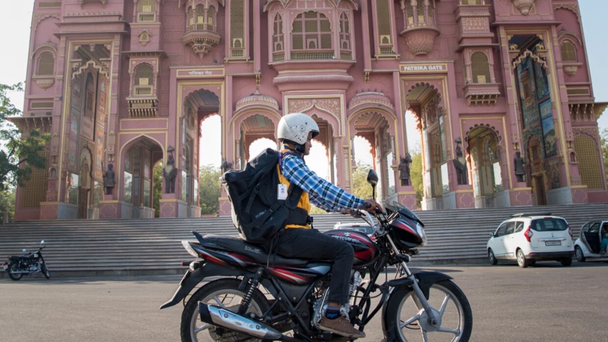 Delivery associate in bike image