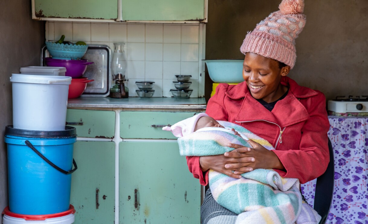 A person smiles for a photo