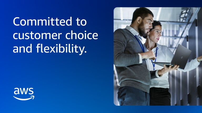 AWS logo and line, "Committed to customer choice and flexibility." Also included is a photo of two people working on a laptop device.