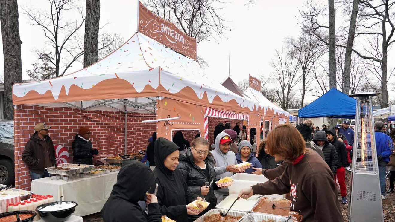 AWS in Communities: individuals gathered eating food