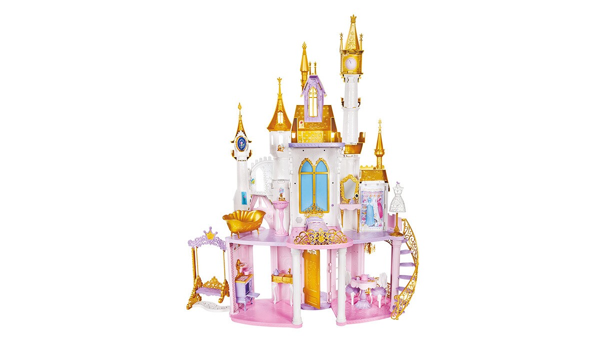 An image of a toy castle with white walls, pink floors, purple trimmings, blue windows, and gold roofing on the castle points.