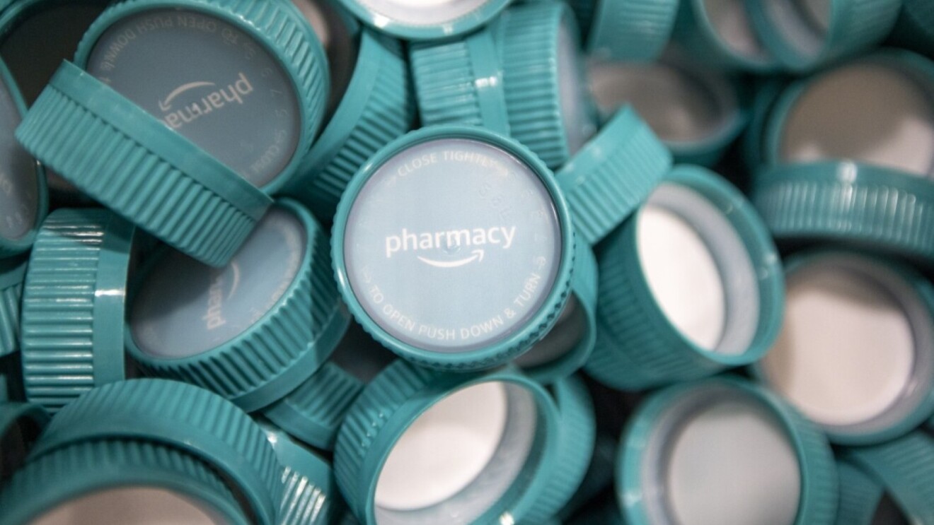 Teal prescription bottle lids featuring Amazon Pharmacy branding