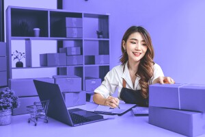 Business owners work on their laptops. 