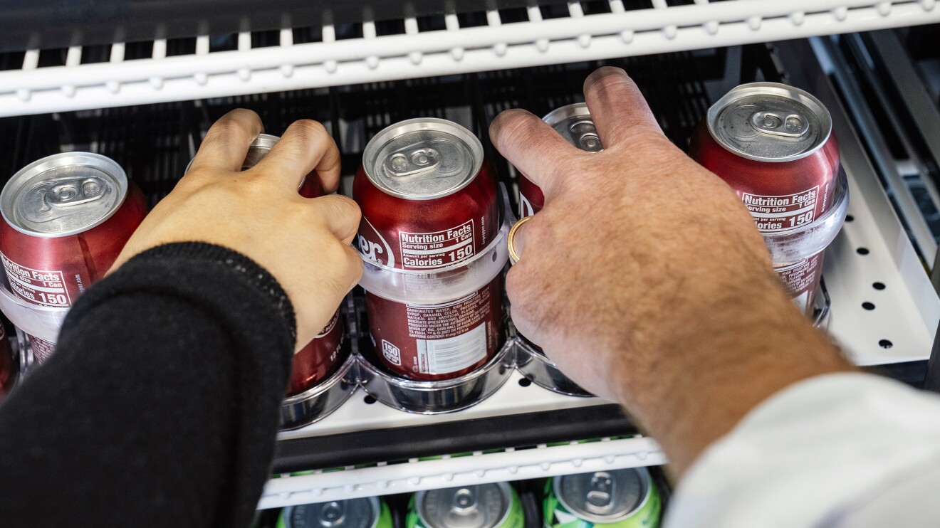 Just Walk Out Technology: hands take products from a shelf in Amazon's Just Walk Out lab