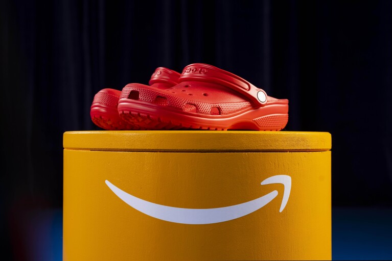 Red crocs on an orange platform
