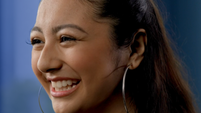 Amazon Future Engineer scholarship recipient smiling and looking at the camera at a 45 degree angle. 