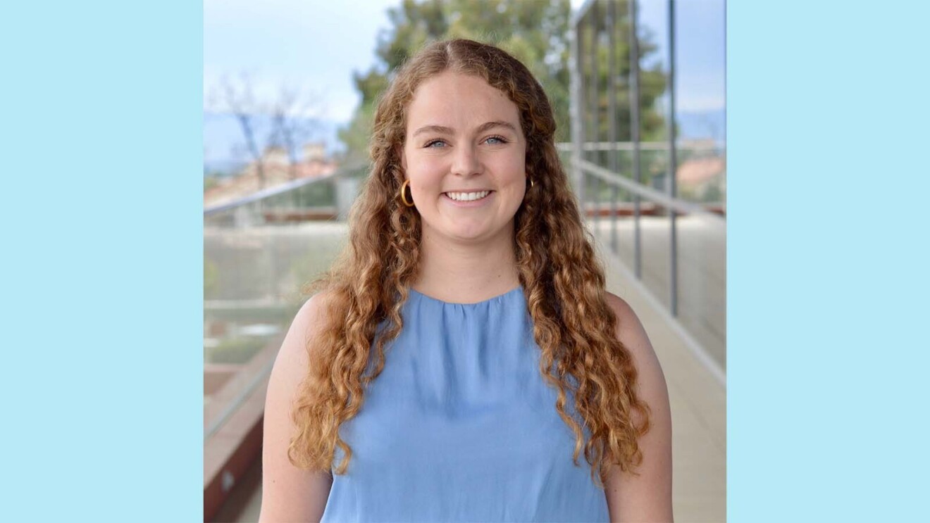 Sally smiling in a professional headshot.