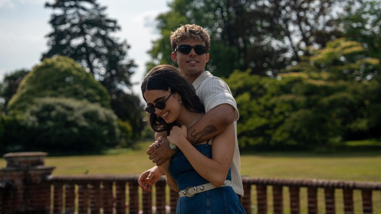 Your Fault London Inline Outdoor, Nick (Matthew Broome) and Noah (Asha Banks) embraced together outside in the garden