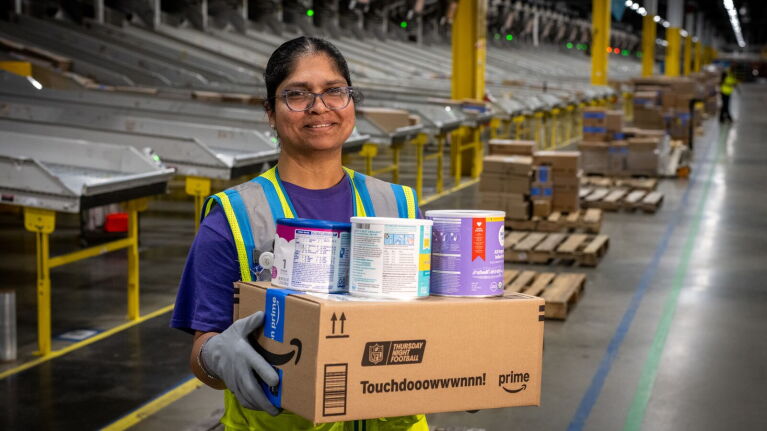 Employee preparing a formula delivery for disaster relief during Hurricane Helene