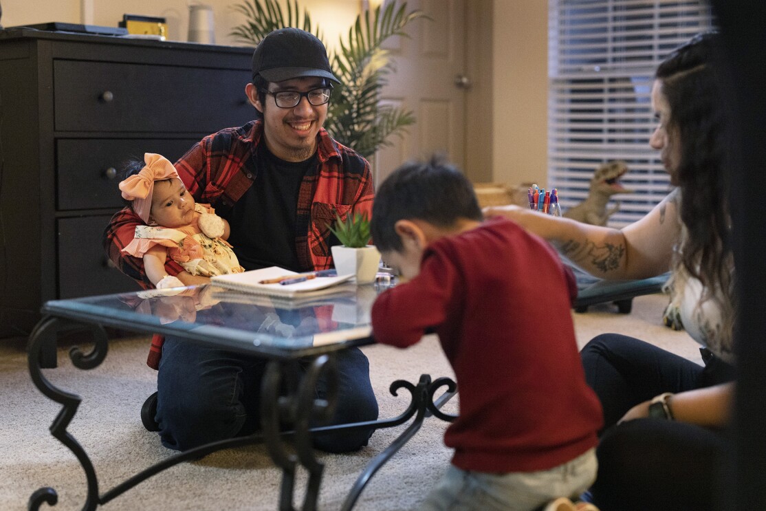 Amazon employees Brisa and Victor who received paid parental leave support from the company when they had their child