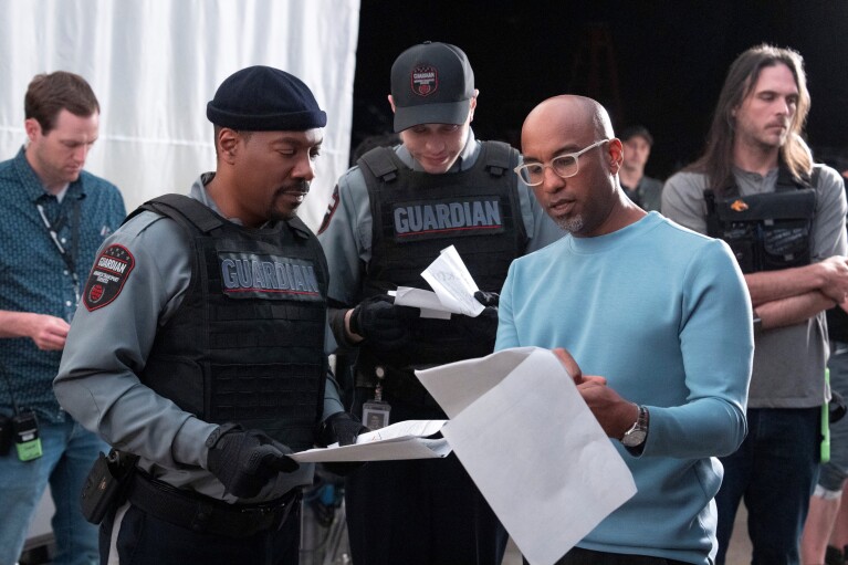 Guardian-uniformed personnel examining papers on set
