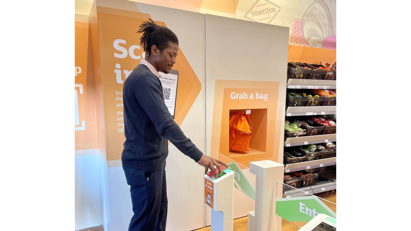 A man enters and shops at the new Sainsbury's location at Holborn Circus, using Amazon's Just Walk Out technology.