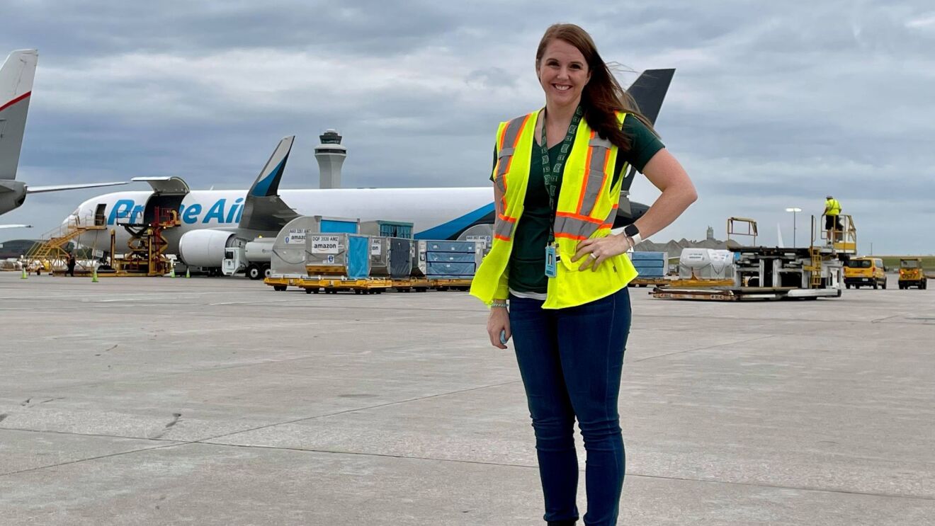 A single person in a safety vest at work with Amazon