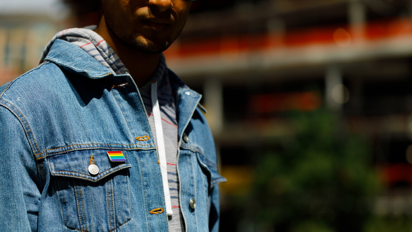 denim jacket with rainbow flag on pocket to support glamazon 