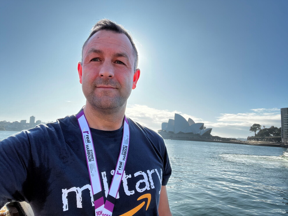 Former army officer and Amazon operations manager wearing his Amazon military shirt