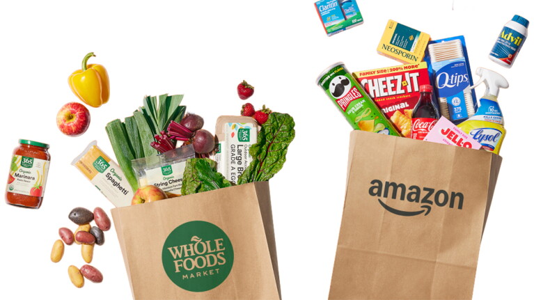 Grocery bags from Whole Foods and Amazon filled with fresh produce and packaged goods