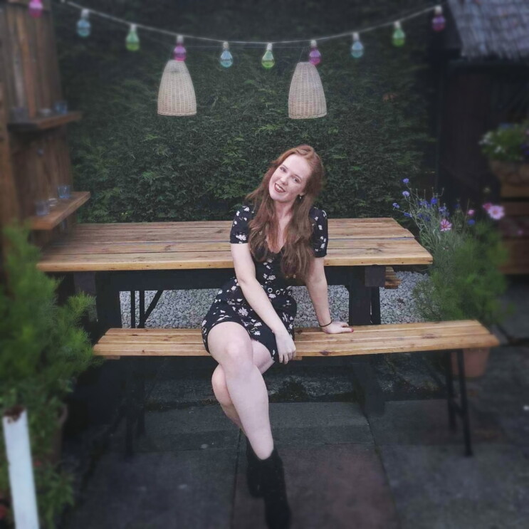 Kirsty Balfour sitting on a bench 