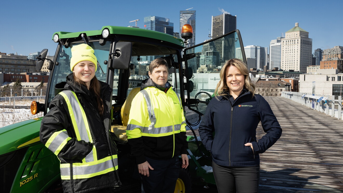 women standing in front of machine 