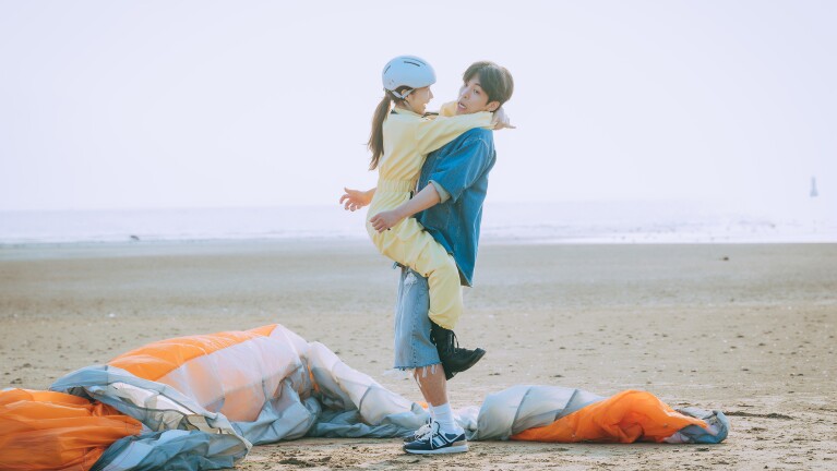 K-dramas on prime video: Confidence Queen; girl with a jumpsuit jumping on guy