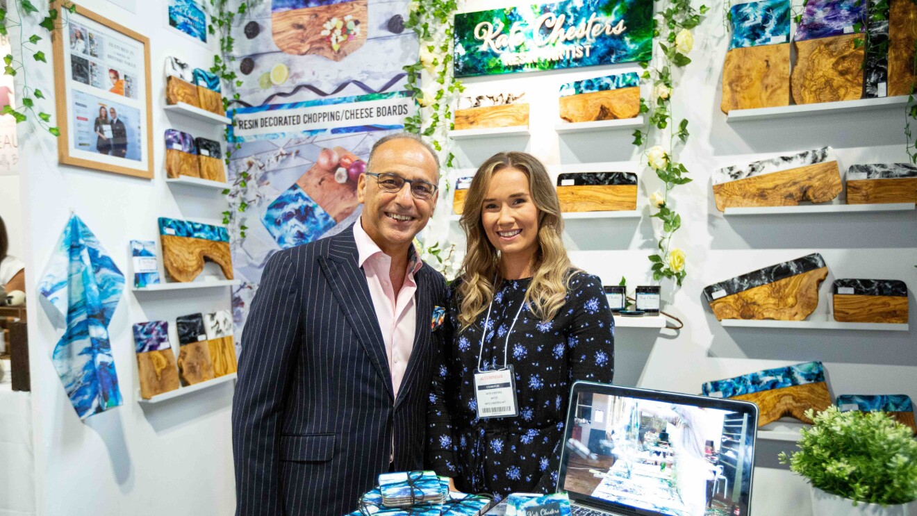 Kate Chesters and Theo Paphitis at her stand at the Autumn Fair, there are lots of Kate's products surrounding them.