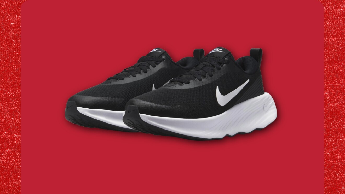 Nike running shoes in black and white on red background