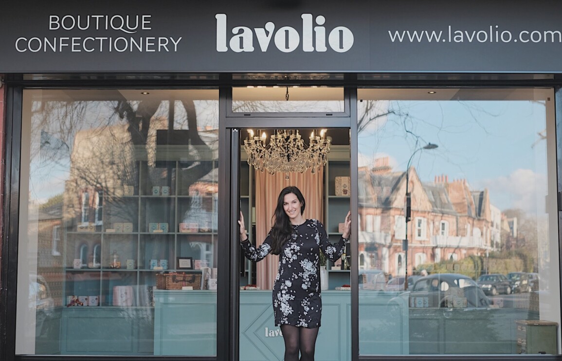 Lavina business owner stood outside shop front 
