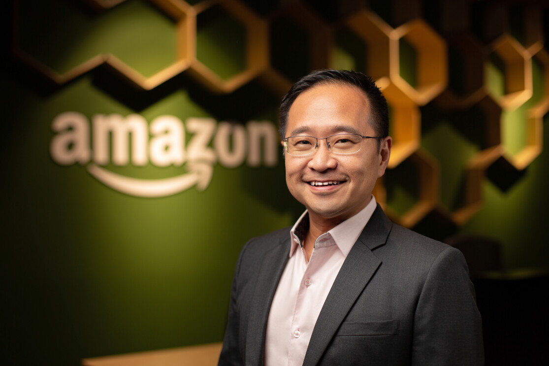 Mr Henry Low, Country Manager at Amazon Singapore, against a backdrop of the Singapore office