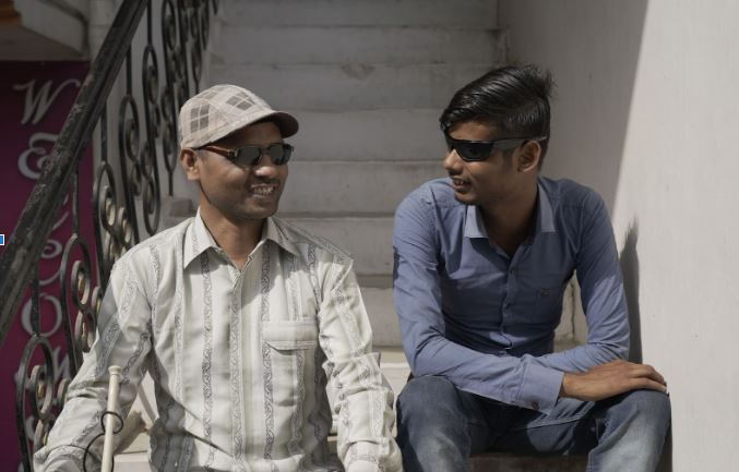 Rakesh Kumar Soni (left) with one of his students. 
