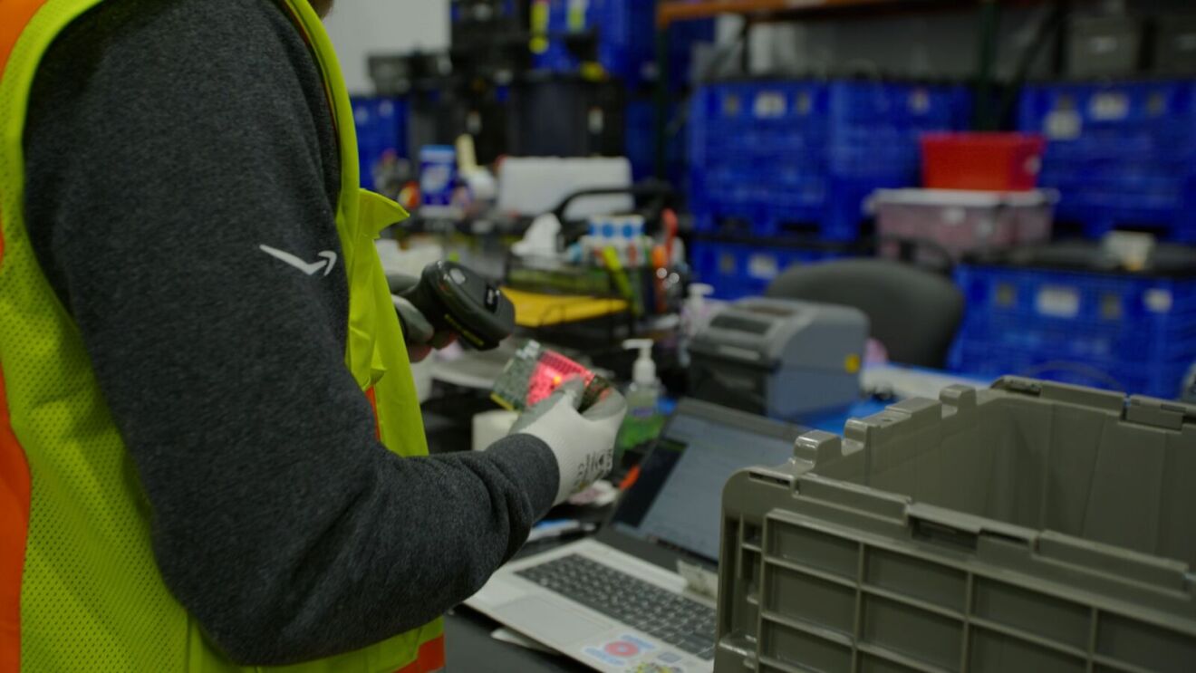 An employee scanning used hardware.