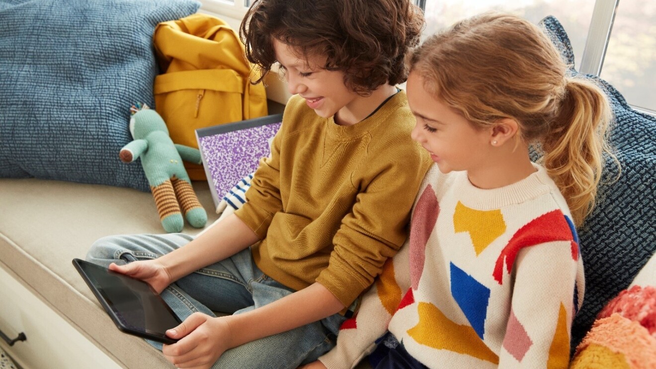 two children use an amazon device