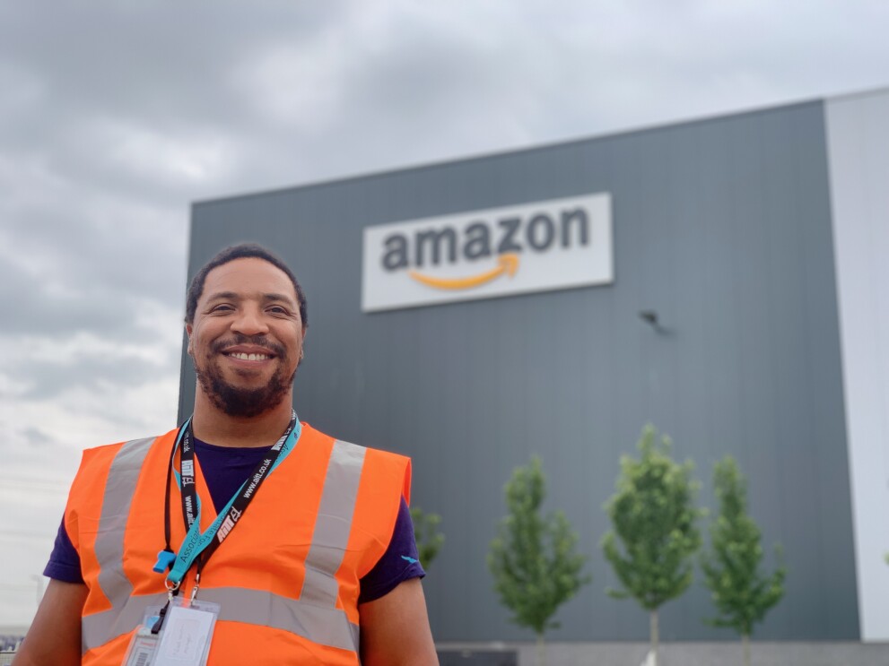 Noel McLean standing in front of an Amazon site
