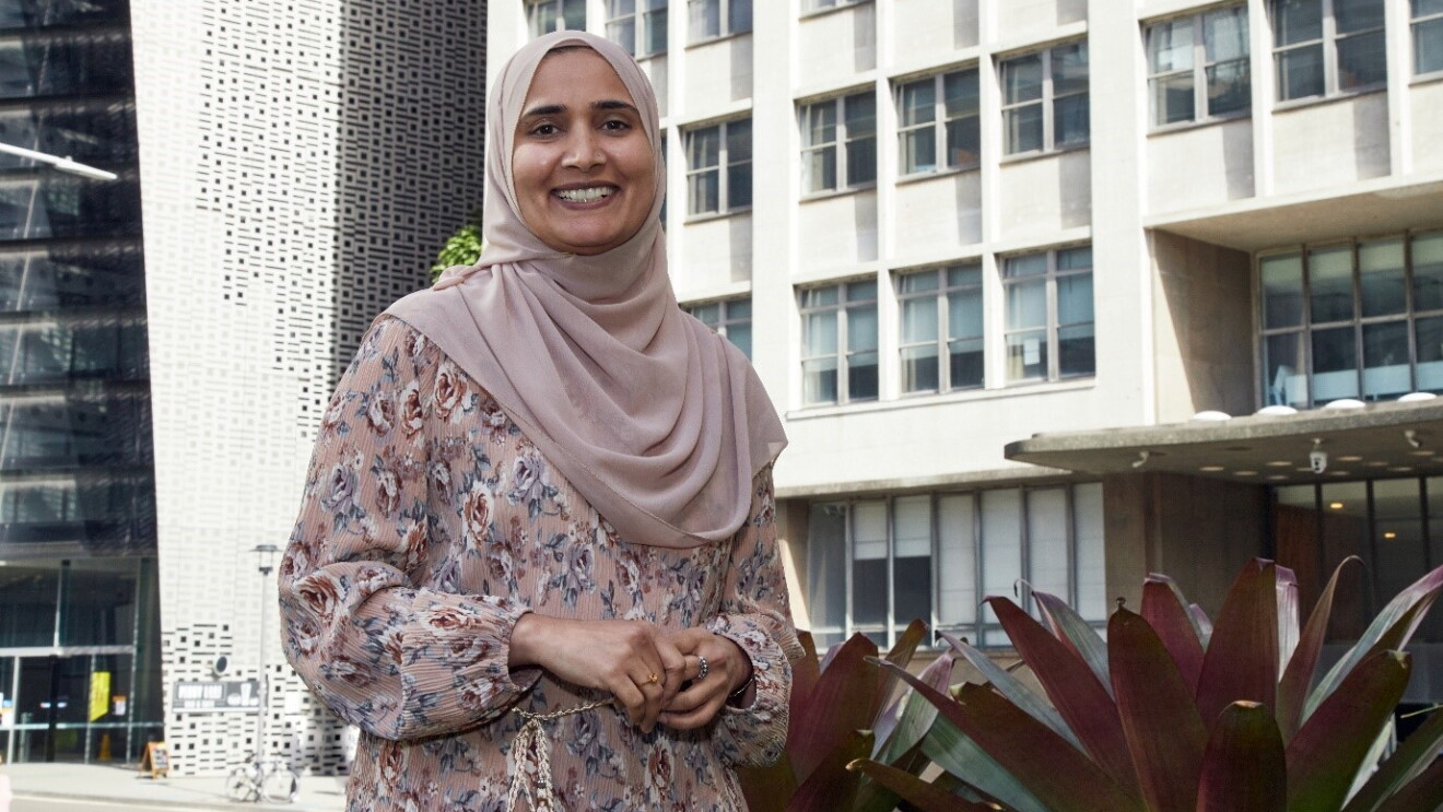 A woman smiling at the camera. 