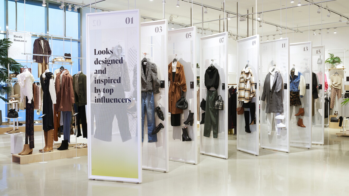 An image of a store with different outfits on display. The outfits were inspired by top influencers. 
