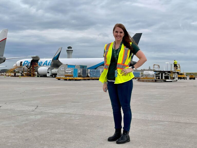 A single person in a safety vest at work with Amazon