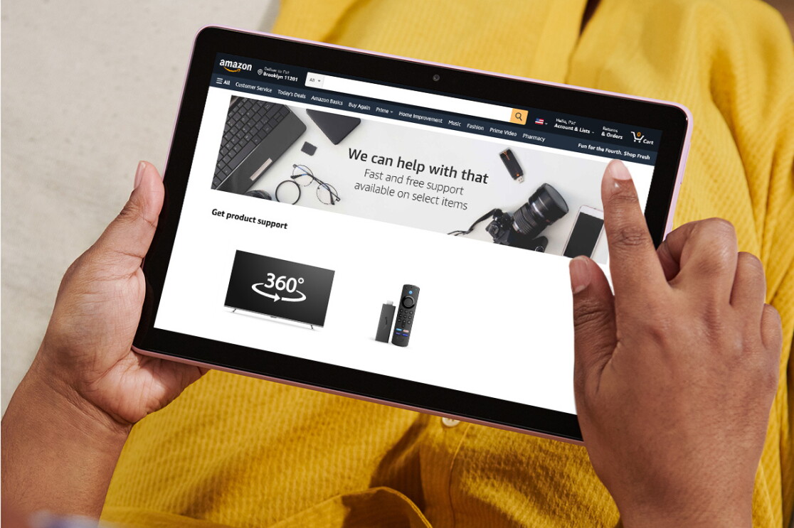 An image showing a person holding a tablet with a 360 view of an Amazon product on the screen