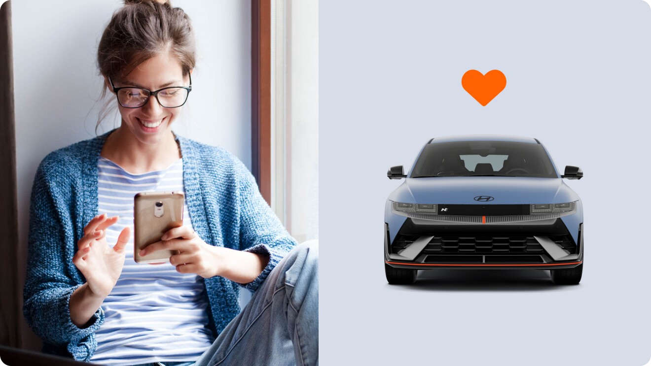 Woman using smartphone near window, Hyundai car with orange heart icon