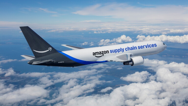 Amazon supply chain services cargo plane flying above clouds