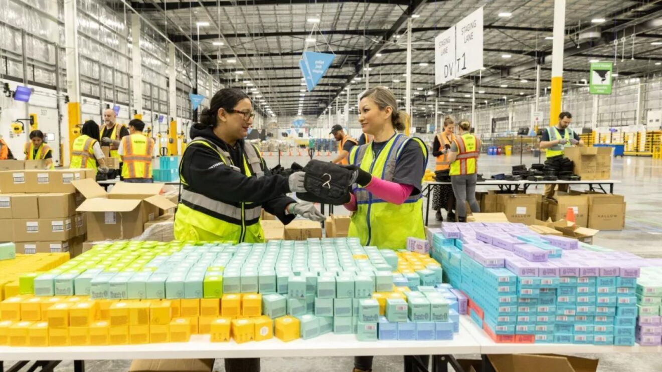 Amazon volunteers packing disaster relief kits in a Disaster Relief Hub.