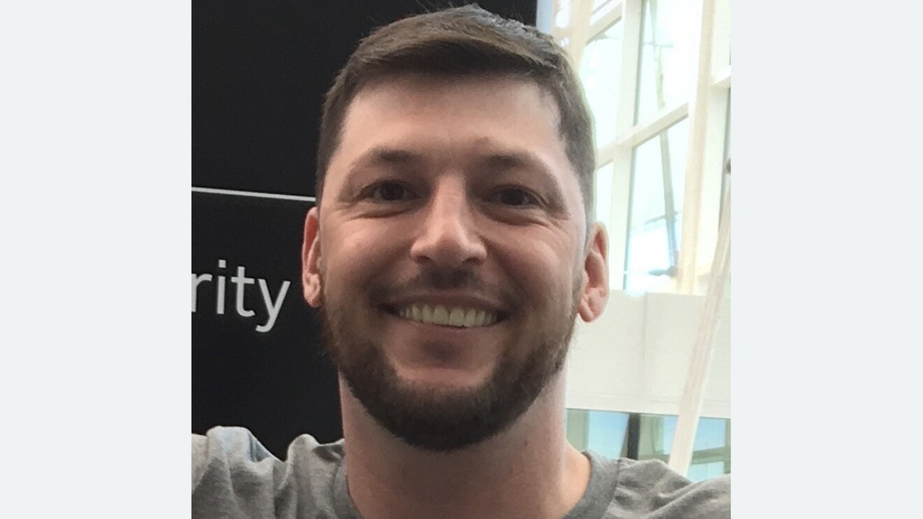 Headshot of a male Amazon employee