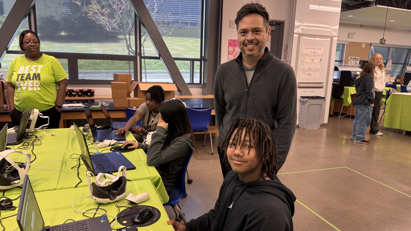 Community learning event with adults and youth using computers