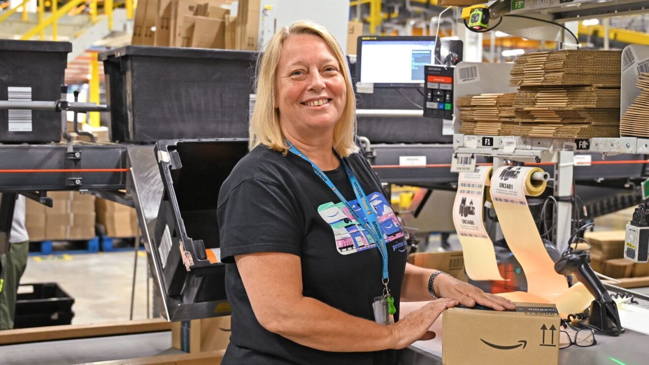 Amazon packer at packing station.