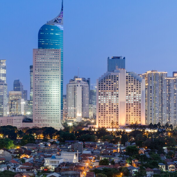 An image of the Jakarta city skyline at dusk.