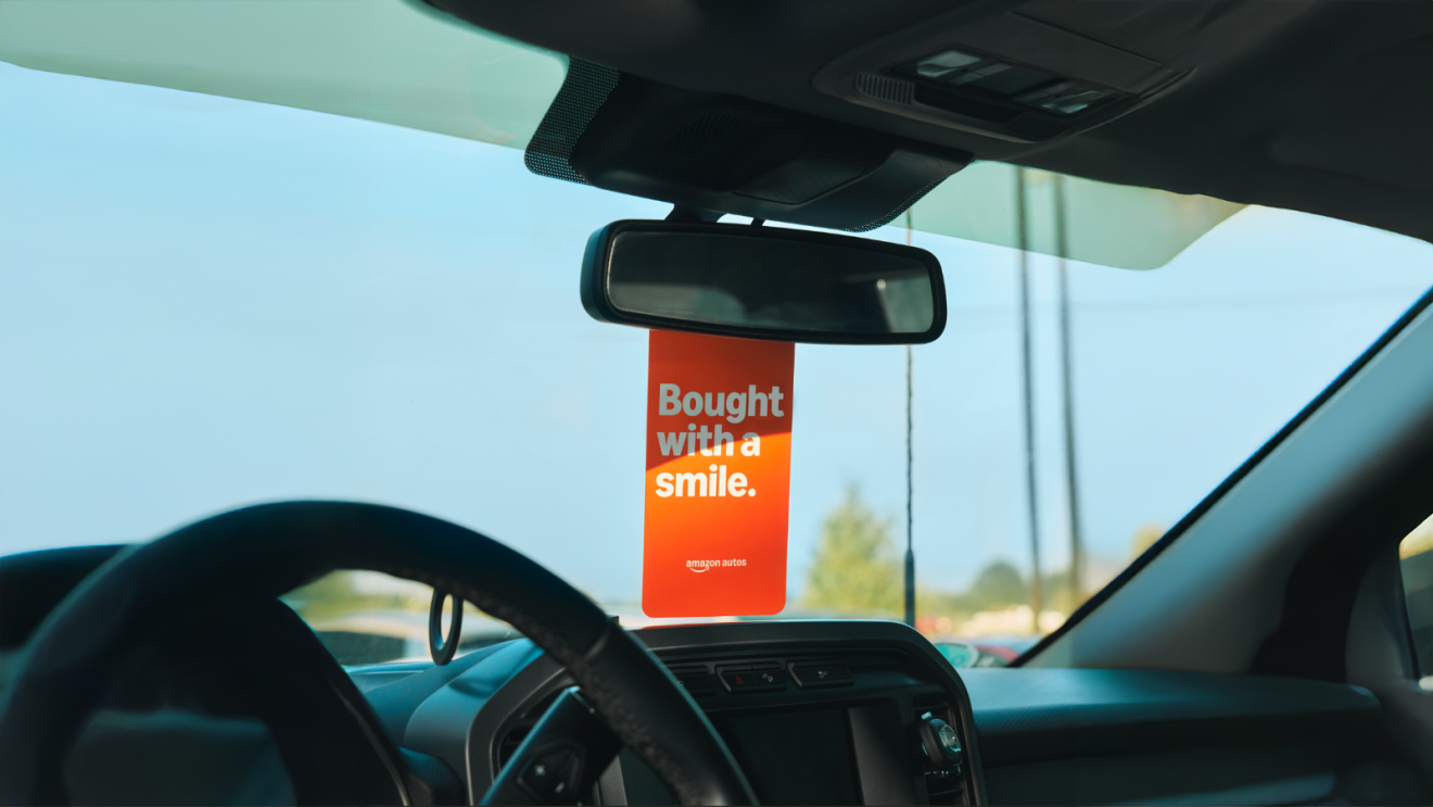 Amazon Autos moto on a scent diffuser hanging inside the car