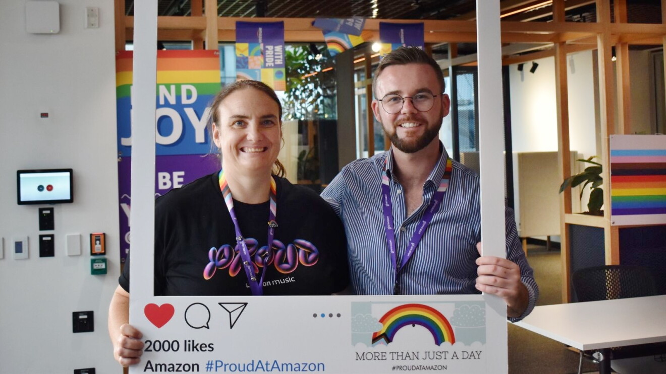 Amazon Australia diversity advocate Katie Daly posing for a photo with a colleague.