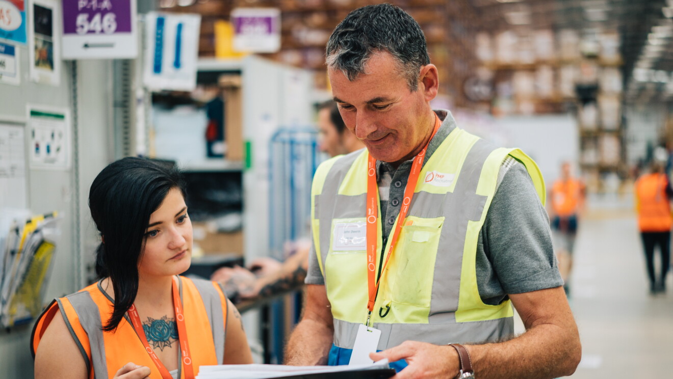 John Sheerin reviewing some health and safety procedure with an Amazon associate