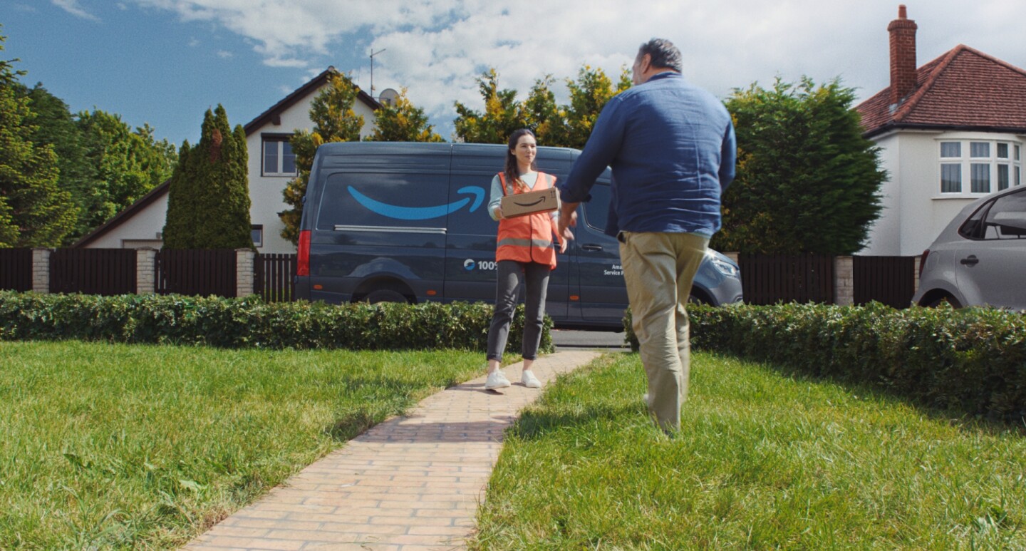 Amazon Delivery Driver handing customer a parcel