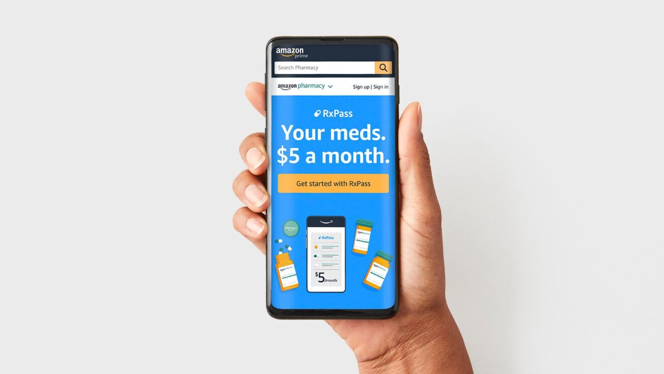 Hand holding smartphone displaying Amazon Pharmacy RxPass offer