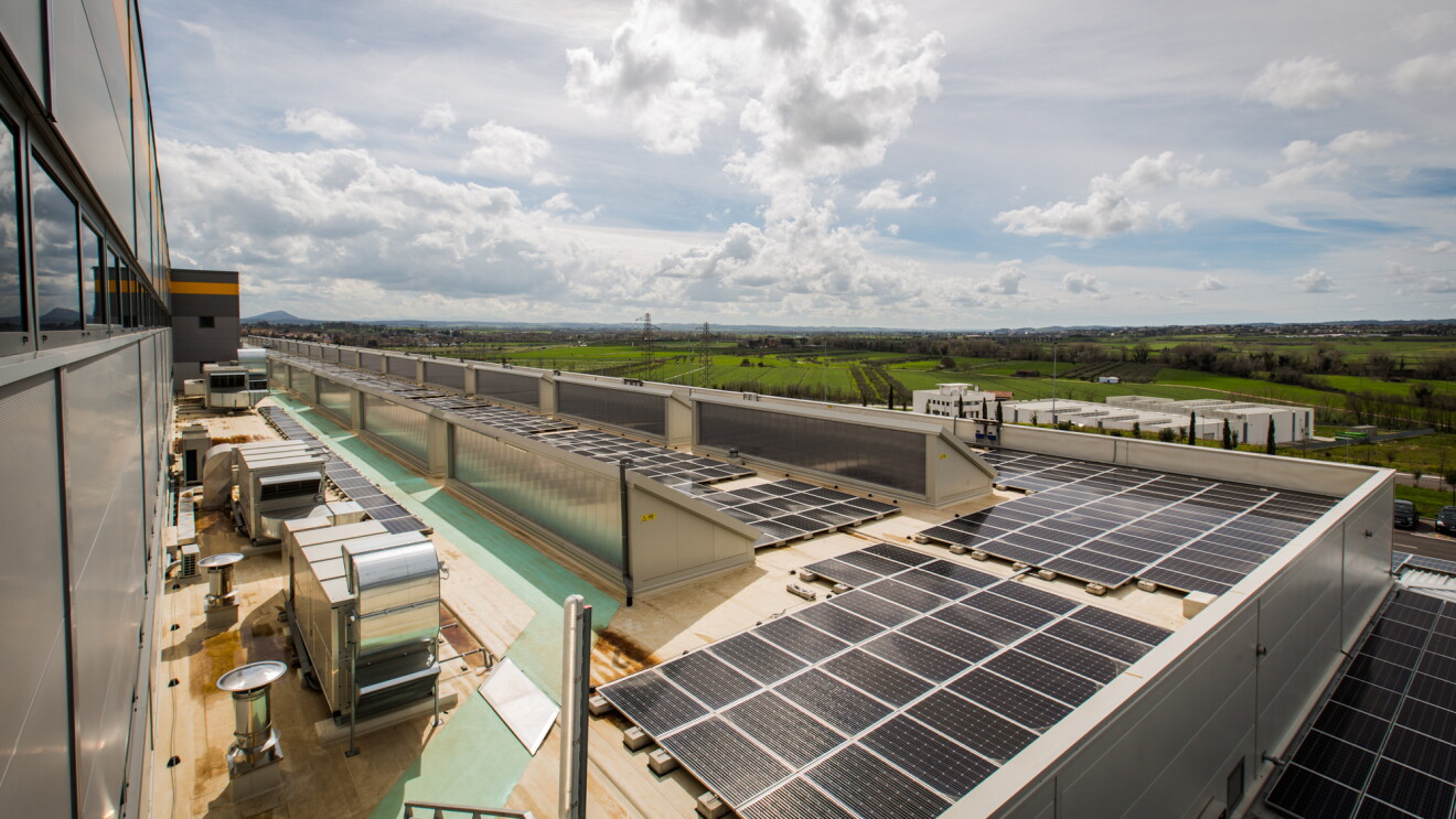 Solar panels on the roof of an Amazon fulfillment center in Italy